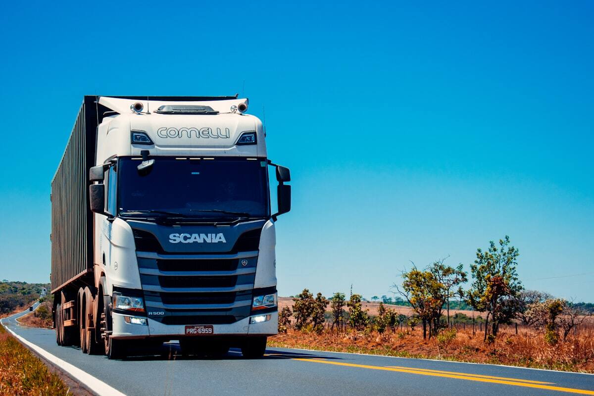 Logistics fleet moving consignments on a highway